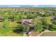 Aerial view of house in a neighborhood with green grass, walking path, and views of the community at 13131 N 153Rd Ave, Surprise, AZ 85379