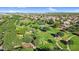 Aerial view of a lush green park with walking paths, trees, green grass, and blue gazebo in a planned community at 13131 N 153Rd Ave, Surprise, AZ 85379