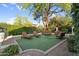 Secluded backyard retreat with outdoor seating amidst the mature trees at 13131 N 153Rd Ave, Surprise, AZ 85379