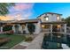 Expansive backyard featuring a pool, patio, and lush landscaping for relaxation and outdoor enjoyment at 13131 N 153Rd Ave, Surprise, AZ 85379