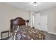 Cozy bedroom with a decorative headboard, floral bedding, and natural light at 13131 N 153Rd Ave, Surprise, AZ 85379