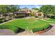 Exterior of clubhouse featuring well manicured lawn, colorful design, and stone walkway at 13131 N 153Rd Ave, Surprise, AZ 85379