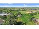 Aerial view of a community park featuring lush greenery, a playground, and sport facilities at 13131 N 153Rd Ave, Surprise, AZ 85379