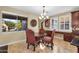 Charming dining area with a round table, ornate chairs, and a large window at 13131 N 153Rd Ave, Surprise, AZ 85379