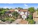 Stunning two-story home showcases a stucco exterior and mature trees at 13131 N 153Rd Ave, Surprise, AZ 85379