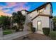 Charming home has a stucco exterior and well-maintained landscaping at 13131 N 153Rd Ave, Surprise, AZ 85379