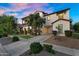 Inviting two-story home showcasing manicured landscaping and a spacious driveway for comfortable living at 13131 N 153Rd Ave, Surprise, AZ 85379