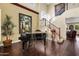 Elegant foyer with hardwood flooring, grand piano, and staircase at 13131 N 153Rd Ave, Surprise, AZ 85379