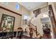 Elegant foyer with a grand staircase, piano, and soaring ceilings, creating a striking first impression at 13131 N 153Rd Ave, Surprise, AZ 85379