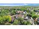 Birds eye view of a neighborhood with trees, lawns, and houses with many different colored tile roofs at 13131 N 153Rd Ave, Surprise, AZ 85379