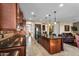 Gourmet kitchen featuring rich wood cabinetry and granite countertops at 13131 N 153Rd Ave, Surprise, AZ 85379
