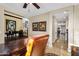 Open-concept space showcasing an office with elegant desk and seamless flow to other areas of the home at 13131 N 153Rd Ave, Surprise, AZ 85379