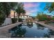 Inviting pool with stone fireplace offering a relaxing outdoor oasis at 13131 N 153Rd Ave, Surprise, AZ 85379