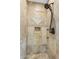 A tiled shower space featuring diamond patterns, decorative accents, and black fixtures at 13131 N 153Rd Ave, Surprise, AZ 85379