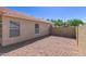 Low maintenance backyard with desert rock and block fence providing privacy at 1350 E Vaughn Ave, Gilbert, AZ 85234