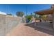 Backyard features a rock landscape, seating area, covered patio, and BBQ for outdoor entertaining at 1350 E Vaughn Ave, Gilbert, AZ 85234
