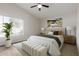 Calm bedroom with a vaulted ceiling, a large window, and neutral decor that offers a serene retreat at 1350 E Vaughn Ave, Gilbert, AZ 85234