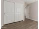 Spacious closet has sliding doors, an open doorway, and wood-look floors at 1350 E Vaughn Ave, Gilbert, AZ 85234