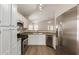 Well-appointed kitchen featuring stainless steel appliances and white cabinetry at 1350 E Vaughn Ave, Gilbert, AZ 85234