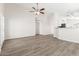Spacious living room with modern flooring and neutral paint at 1350 E Vaughn Ave, Gilbert, AZ 85234