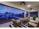 Covered back patio with comfortable seating and pool view at 14979 S 184Th Ave, Goodyear, AZ 85338