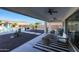 Inviting backyard featuring a covered patio, pool, outdoor kitchen, and a well-maintained landscape at 14979 S 184Th Ave, Goodyear, AZ 85338