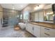 Modern bathroom featuring dual vanities, soaking tub, and a separate shower space at 14979 S 184Th Ave, Goodyear, AZ 85338