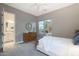 Comfortable bedroom with carpet flooring, two windows, and a neutral palette at 14979 S 184Th Ave, Goodyear, AZ 85338
