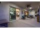 Charming covered patio with comfortable seating, and views of the interior at 14979 S 184Th Ave, Goodyear, AZ 85338