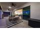 Charming covered patio with comfortable seating, and views of the interior at 14979 S 184Th Ave, Goodyear, AZ 85338