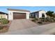 Beautiful home with a two-car garage and desert landscaping at 14979 S 184Th Ave, Goodyear, AZ 85338