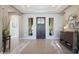 Spacious foyer with tile flooring and a view of the front door at 14979 S 184Th Ave, Goodyear, AZ 85338