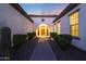 Inviting front entrance with desert landscaping, brick walkway, and arched doorway at 14979 S 184Th Ave, Goodyear, AZ 85338