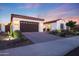 A well-maintained front yard, a spacious driveway, and a lovely two-car garage enhance the curb appeal at 14979 S 184Th Ave, Goodyear, AZ 85338