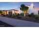 This charming home boasts mature landscaping, a two-car garage, and a beautifully maintained lawn at 14979 S 184Th Ave, Goodyear, AZ 85338