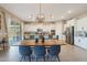 Bright kitchen with a large island, stainless appliances, and lots of counter space for cooking at 14979 S 184Th Ave, Goodyear, AZ 85338