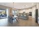 Eat-in kitchen with ample counter seating, stainless appliances, and sliding glass doors to patio at 14979 S 184Th Ave, Goodyear, AZ 85338