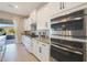 Bright kitchen featuring stainless steel appliances and direct access to the outdoor living area at 14979 S 184Th Ave, Goodyear, AZ 85338