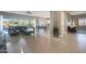 Open-concept living room with tile floors and a view of the backyard at 14979 S 184Th Ave, Goodyear, AZ 85338