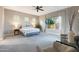 Spacious main bedroom with natural light, carpeted floors, and relaxing sitting area at 14979 S 184Th Ave, Goodyear, AZ 85338
