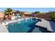 Backyard pool with basketball hoop and outdoor kitchen area at 14979 S 184Th Ave, Goodyear, AZ 85338
