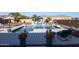 Beautiful pool with outdoor kitchen area featuring grill and television at 14979 S 184Th Ave, Goodyear, AZ 85338