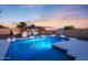 A private backyard pool featuring lush landscaping, a gazebo, and plenty of room for summer fun at 14979 S 184Th Ave, Goodyear, AZ 85338