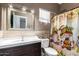 Bathroom with decorative shower curtain, wood look walls, and large mirror at 1560 E Flint St, Chandler, AZ 85225