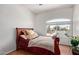 A bedroom with a bed and a window with view of the street at 1560 E Flint St, Chandler, AZ 85225