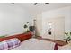 Well-lit bedroom with a closet, sliding doors, and a mini fridge in the corner at 1560 E Flint St, Chandler, AZ 85225