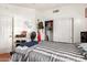 Bedroom with white walls and slider closet doors, wood look flooring at 1560 E Flint St, Chandler, AZ 85225