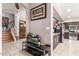 A beautifully decorated hallway features elegant furnishings and a seamless transition into the kitchen and staircase at 1560 E Flint St, Chandler, AZ 85225