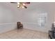 Neutral living room offering ample space, tile flooring, window with blinds, and simple furnishings at 1560 E Flint St, Chandler, AZ 85225