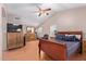 Spacious main bedroom with vaulted ceilings, ceiling fan, a large bed, and ample natural light at 1560 E Flint St, Chandler, AZ 85225